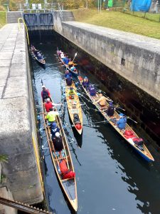 Rowoing in Germany touring boats in a lock